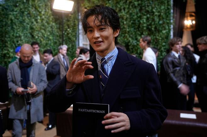 Mark Lee of NCT attends the Ralph Lauren fall-winter 2026-2027 men's fashion show in Milan on Jan. 16 (AP Photo/Luca Bruno)