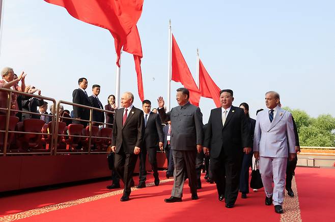 Russian President Vladimir Putin, Chinese President Xi Jinping, North Korean leader Kim Jong-un and Pakistan's Prime Minister Shehbaz Sharif arrive at the Tiananmen Gate for a military parade marking the 80th anniversary of the end of World War Two, in Beijing on Sept. 3, 2025. From front left: Vladimir Putin, Xi Jinping, Kim Jong-un and Shehbaz Sharif. [REUTERS/YONHAP]