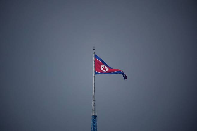A North Korean flag flutters at the propaganda village of Gijungdong in North Korea, in this picture taken near the truce village of Panmunjom inside the demilitarized zone in South Korea on July 19, 2022. [REUTERS/YONHAP]