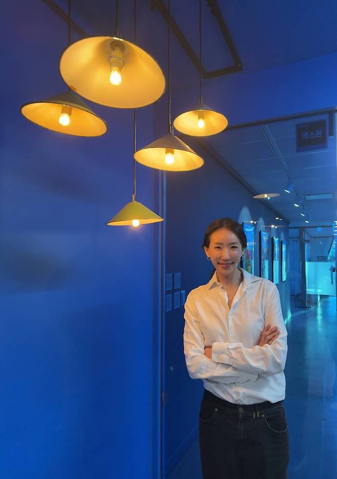 Woo Jee-hee, CEO of OCON, poses for a photo in front of her office in Seongnam, Gyeonggi Province, in December 2025. (OCON)
