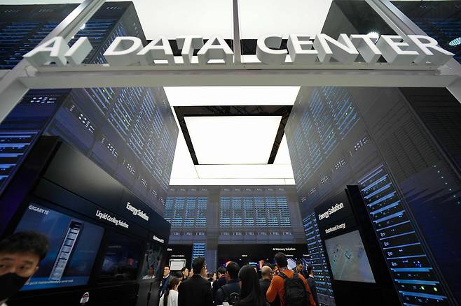 People view an AI data center at the SK Networks stand during the Mobile World Congress (MWC), the world's biggest mobile fair, in Barcelona, Spain, on March 3, 2025. [AFP/YONHAP]