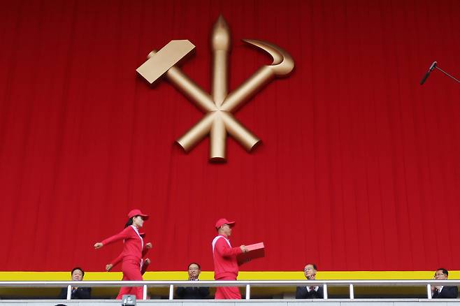 A man prepares to present a letter of loyalty to a senior official at a meeting to present the letters to leader Kim Jong-un in Pyongyang, North Korea, on Oct. 7, 2025, on the occasion of the 80th anniversary of the founding of North Korea's ruling Workers' Party of Korea. [AP/YONHAP]