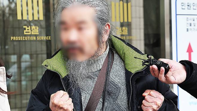 Cho Doo-soon answers questions from reporters after attending his first trial hearing at the Suwon District Court’s Ansan branch in Ansan, Gyeonggi, on March 11, 2024. [YONHAP]