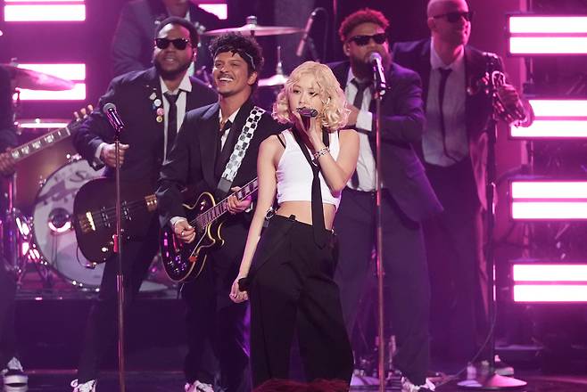 Rose (center) and Bruno Mars (second row, left) perform "APT." during the 68th annual Grammy Awards at Crypto.com Arena in Los Angeles, California, Sunday. (AP via Yonhap)