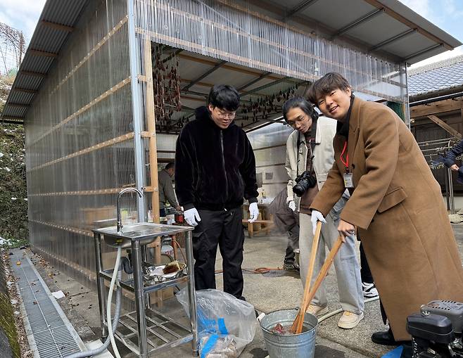 Three Korean undergraduates wash Konjac, a root vegetable used to make Japanese gelatinous food, at their home-stay residence in Mima City, Tokushima Prefecture, Japan, on Jan. 25.