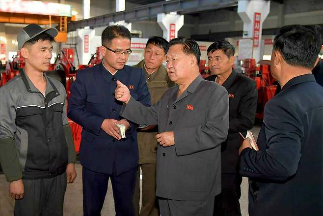 This photo, published by the state-run Korean Central News Agency on Oct. 26, shows Choe Ryong-hae, center, chairman of the Standing Committee of the Supreme People's Assembly of North Korea, inspecting various projects, including at farms and coal mines. [KOREAN CENTRAL NEWS AGENCY]