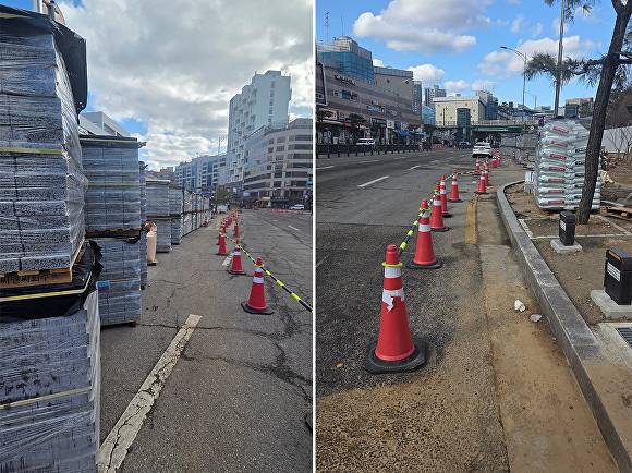 지난 3일 동백종합복지회관 공사 현장에 설치된 보행로(왼쪽) 옆에 보도블럭 자재가 쌓여 있다. 사진 오른쪽은 보행로를 알리는 라바콘이 관리되지 않은 채 세워져 있다. [사진=정재수 기자]
