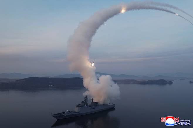 This photo, carried by the North's state-run Korean Central News Agency on Wednesday, shows the test-firing of strategic cruise missiles from the Choe Hyon destroyer the previous day. (KCNA-Yonhap)