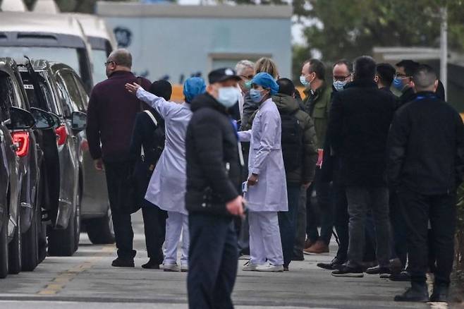 2021년 1월 일 중국 우한의 병원 찾은 세계보건기구(WHO) 코로나19 기원 조사팀. 연합뉴스