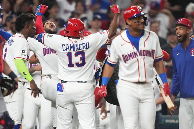 Dominican Republic's Junior Caminero (13) celebrates his home run during the second inning of a World Baseball Classic semifinal game against the United States, Sunday, March 15, 2026, in Miami. (AP Photo/Lynne Sladky)