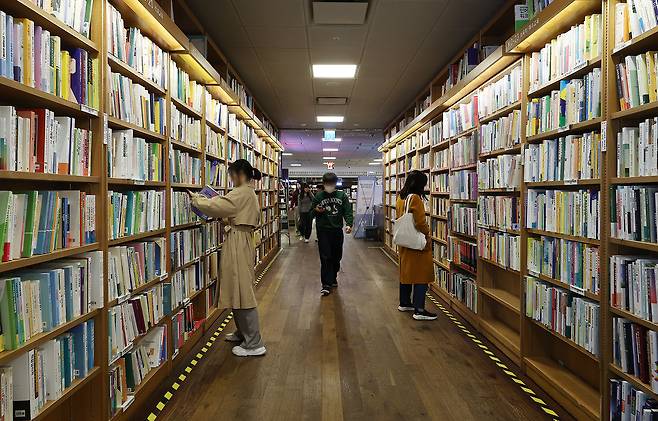 Visitors are seen in a book store in downtown Seoul on Nov. 13, 2025. [YONHAP]