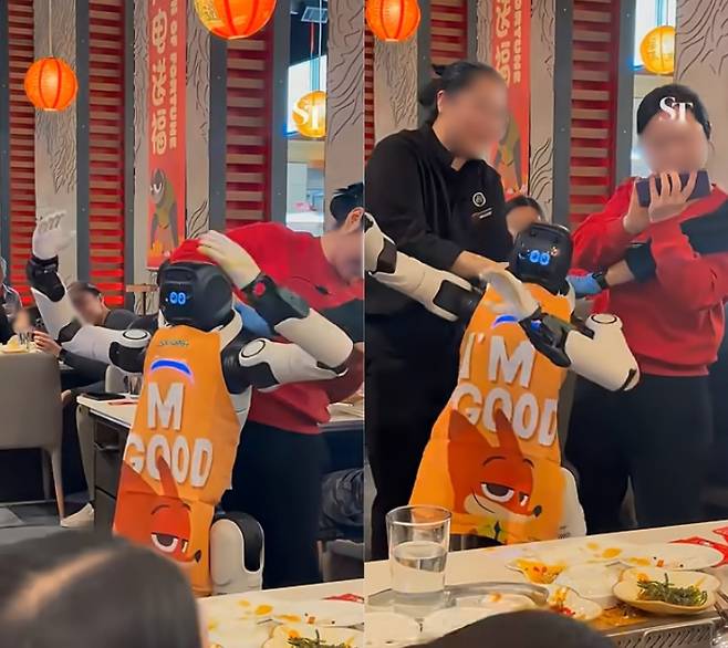 춤을 안 멈추는 로봇을 제지하려는 식당 직원들 [The Straits Times 유튜브 캡처]