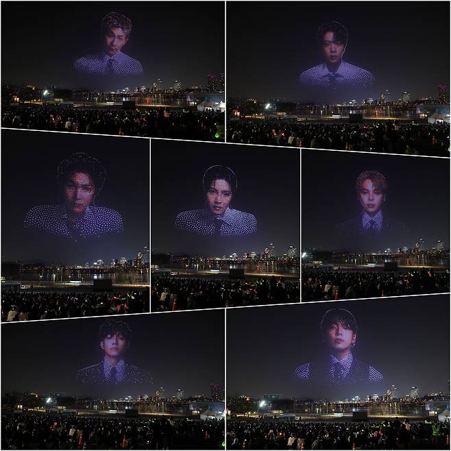 방탄소년단(BTS)의 완전체 컴백 공연을 하루 앞둔 20일 밤 서울 뚝섬한강공원에서 관련 드론쇼가 펼쳐지고 있다. [연합]