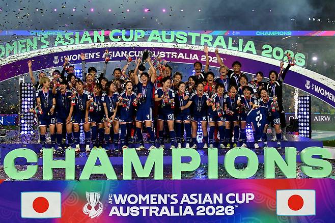 Japan's team celebrate with the trophy after winning the final of the AFC Women?s Asian Cup Australia 2026 football tournament between Australia and Japan at Stadium Australia in Sydney on March 21, 2026. (Photo by Saeed Khan / AFP) / --IMAGE RESTRICTED TO EDITORIAL USE - STRICTLY NO COMMERCIAL USE--







<저작권자(c) 연합뉴스, 무단 전재-재배포, AI 학습 및 활용 금지>