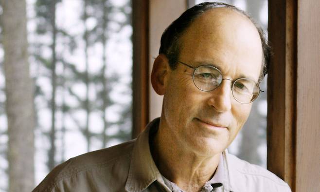 FILE - Author Tracy Kidder stands in his cottage, in South Bristol, Maine, on Sept. 26, 2005. (AP Photo/Pat Wellenbach, File)