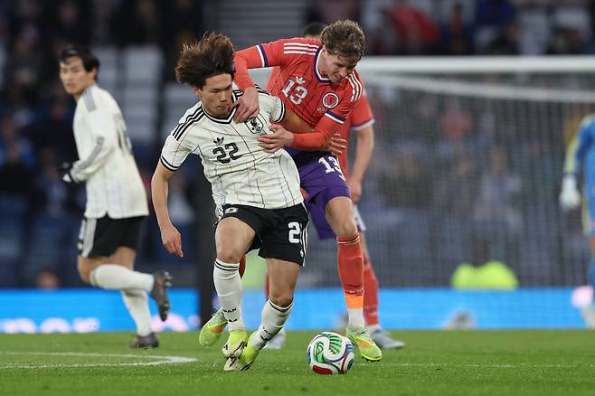 Japan's Kento Shiogai, left, challenges for the ball with Scotland's Jack Hendry during the international friendly soccer match between Scotland and Japan in Glasgow, Scotland, Saturday, March 28, 2026. (AP Photo/Scott Heppell)







<저작권자(c) 연합뉴스, 무단 전재-재배포, AI 학습 및 활용 금지>