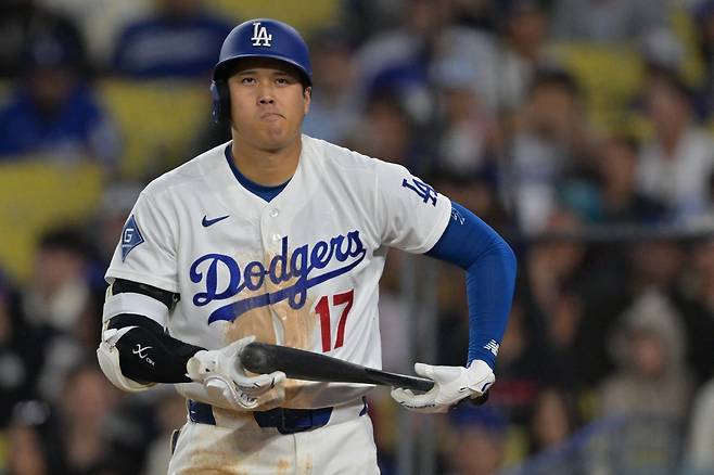 Apr 1, 2026; Los Angeles, California, USA;  Los Angeles Dodgers two-way player Shohei Ohtani (17) reacts after he was called out on a checked swing with bases loaded to end in the eighth inning against the Cleveland Guardians at Dodger Stadium. AP연합뉴스