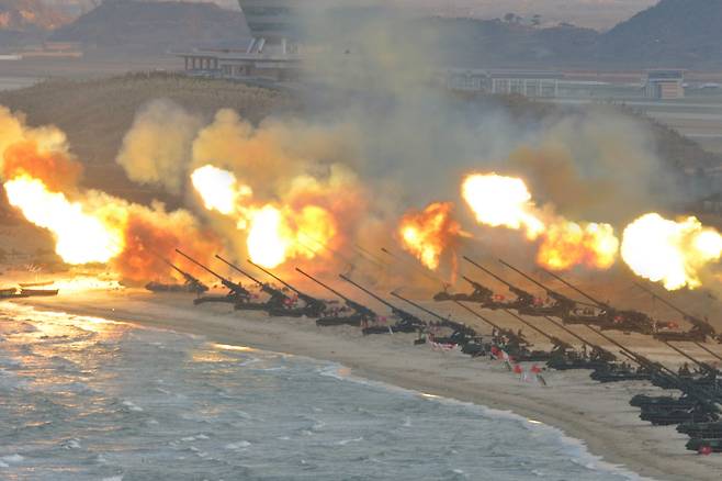 The North Korean military is seen firing artillery during a training session on June 17, 2018, in this photo released by the Korean Central News Agency. [YONHAP