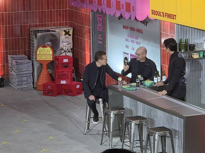 Mathias Geisen, sales and customer experience chief, third from right, Chief Technology Officer Mathias Geisen, second from right, and actor Park Jae-min perform a skit during the all-new electric C-Class during the vehicle's world premiere event held at pop-up venue XYZ Seoul in Seongdong District, eastern Seoul, on April 20. [KIM MIN-YOUNG]