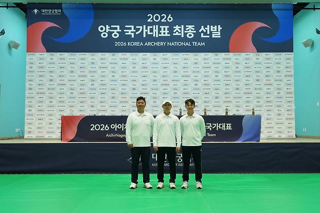 From left: Kim Woo-jin, Lee Woo-seok and Kim Je-deok pose for a photograph after securing their spots to compete at the 2026 Aichi-Nagoya Asian Games following qualifiers in Yecheon, North Gyeongsang, on April 17. [KOREA ARCHERY ASSOCIATION]