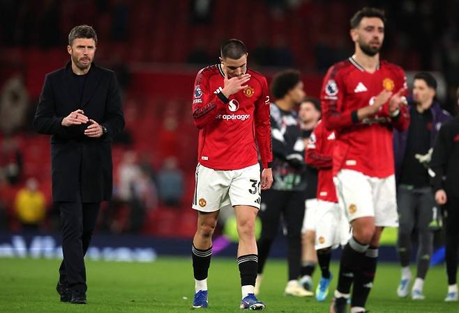 SOCCER-ENGLAND-MUN-LEE/