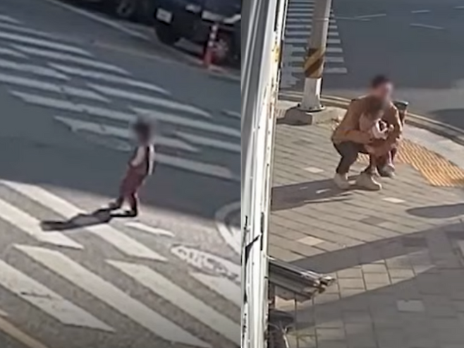 경남 창원시 진해구의 한 사거리에서 2살 여자아이가 빨간불 신호에 도로 한복판을 걸어가는 모습을 본 시민이 곧장 달려가 아이를 안아 인도로 옮겼다. /사진=경찰청 유튜브 캡처