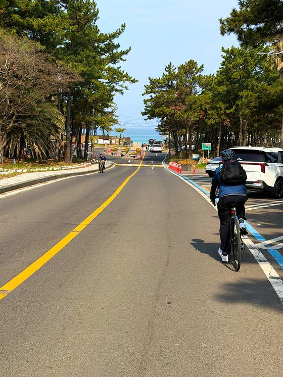 Riding toward the sea somewhere near Aewol in Jeju on April 3. [JIM BULLEY]