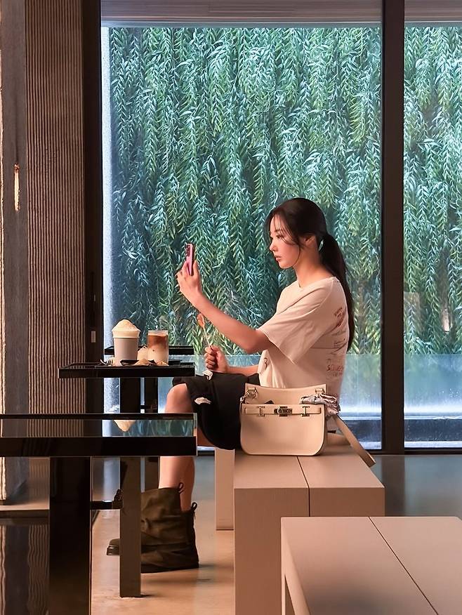 Actress Kim Sa-rang shared glimpses of her sophisticated daily life and unchanging youthful appearance on her social media, defying her age of 48. Through recent photos showing her spending a relaxing time at a cafe, Kim Sa-rang captivated attention by showcasing a comfortable yet stylish look.In the released photos, Kim Sa-rang exuded an unrivaled aura in a natural outfit consisting of a loose T-shirt, a mini skirt, and boots. Even amidst a styling that appeared effortless, her distinct features and slender legs stood out.Born in 1978 and 48 years old this year, Kim Sa-rang drew admiration from many for her visuals that seem untouched by time. Fans expressed enthusiastic interest in her timeless beauty, commenting that she looks like a goddess.