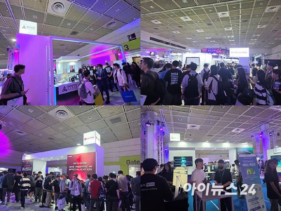 AWS 서밋 서울 2026 엑스포에 마련된 메가존클라우드, 베스핀글로벌, LG CNS, GS네오텍 부스에서 참관객들이 서비스를 체험하고 있다. [사진=윤소진 기자]