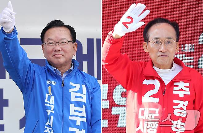 22일 오전 김부겸 더불어민주당 대구시장 후보(왼쪽)가 대구 중구 반월당사거리에서 출근길 시민들을 향해 인사하고 있다. 추경호 국민의힘 대구시장 후보는 이날 오전 수성구 범어네거리에서 출근길 아침 인사했다. 2026.5.22 ⓒ 뉴스1 공정식 기자