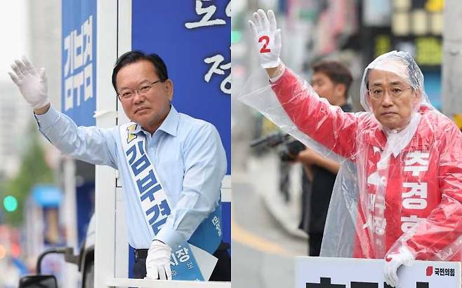 김부겸 더불어민주당 대구시장 후보(왼쪽)와 추경호 국민의힘 후보가 6·3 지방선거를 하루 앞둔 2일 시민들에게 인사하고 있다. 연합뉴스