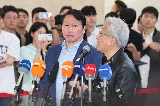 SK Group Chairman Chey Tae-won, left, and Jensen Huang, CEO of Nvidia, participate in a press briefing held at SK Group's headquarters in Seoul on June 8, 2026. YONHAP
