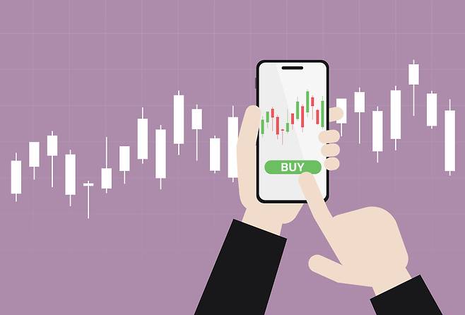 An illustration shows an investor buying stocks. GETTY IMAGES PRO