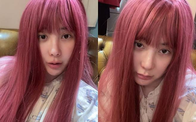 Singer Seo In-young showcased a unique charm by posting a photo of herself wearing a pink wig on her social media account. Seo In-young, who usually maintains short hair, captivated fans with her doll-like visuals through this transformation.Recently, Seo In-young has been garnering much attention after announcing her remarriage to a non-celebrity six years her senior. She shared the wedding preparation process on her YouTube channel, announcing that she had completed the formal meeting between the families.