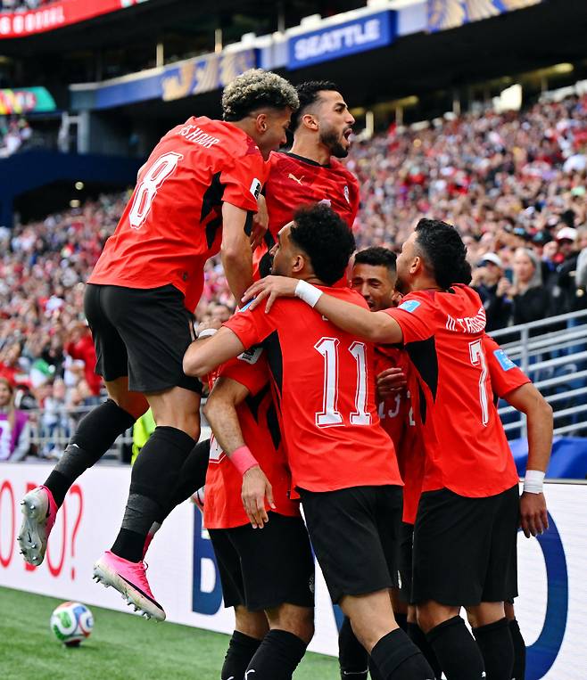 Soccer Football - FIFA World Cup 2026 - Group G - Egypt v Iran - Seattle Stadium, Seattle, Washington, U.S. - June 26, 2026 Egypt's Mahmoud Saber celebrates scoring their first goal with teammates IMAGN IMAGES via Reuters/Steven Bisig

<저작권자(c) 연합뉴스, 무단 전재-재배포, AI 학습 및 활용 금지>