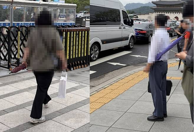 우산을 가로로 들고 다니는 행인들 모습. 연합뉴스