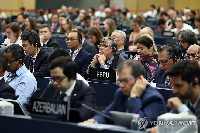 제48차 유네스코 세계유산위원회 본회의 (부산=연합뉴스) 윤동진 기자 = 20일 부산 벡스코에서 열린 제48차 유네스코 세계유산위원회 본회의에서 참석자들이 허민 국가유산청장의 발언을 듣고 있다. 2026.7.20 mon@yna.co.kr