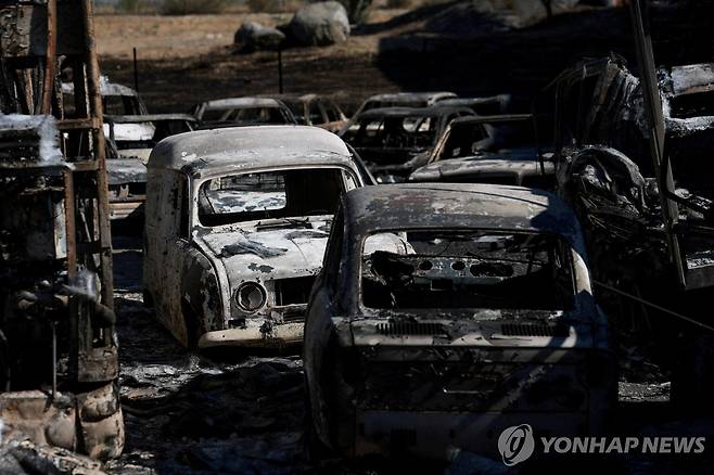 스페인 산불에 타버린 자동차 [로이터=연합뉴스 자료사진. 재판매 및 DB 금지]