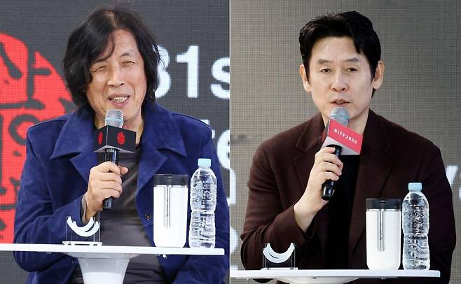 7일 부산 해운대구 영화의전당에서 열린 부산국제영화제 '가능한 사랑' 오픈토크에서 이창동 감독과 배우 설경구가 서로 재킷을 바꿔 입고 무대에 올랐다. 연합뉴스·뉴시스
