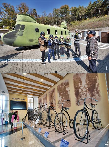 [월간산]1 경천대관리소 뒤편에 위치한 밀리터리테마파크. 추억의 전쟁놀이를 즐길 수 있는 곳으로, 특히 어린 아이들에게 인기다.  2  자전거박물관의 전시기획실. 자전거 발달사를 보여주는 곳이다.