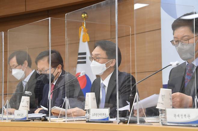 Finance ministry officials speak at a press briefing held at the government complex in Sejong on Tuesday. The briefing was embargoed until Wednesday. (Ministry of Economy and Finance)