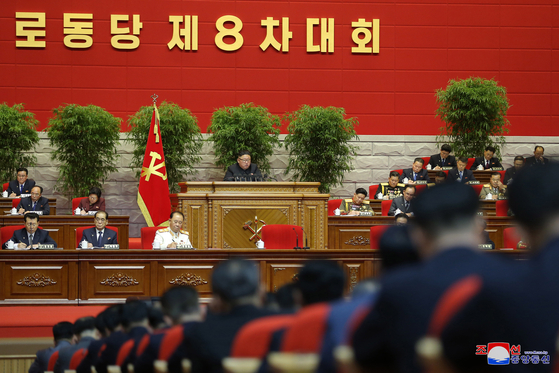 North Korean leader Kim Jong-un delivers a speech at the second day of the 8th Party Congress on Wednesday, as shown in this state media photograph. [YONHAP]