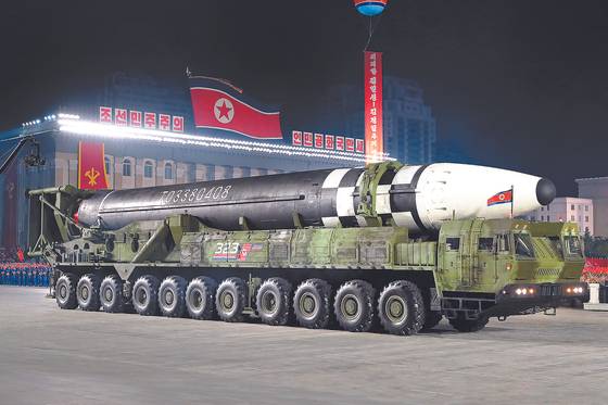 A new form of an intercontinental ballistic missile shown off on an 11-axle launcher by North Korea during a military parade in October. Kim mentioned the missile among several other new weapons as examples of some of the newest additions to the regime's arsenal aimed at deterring foreign aggression. [NEWS1]