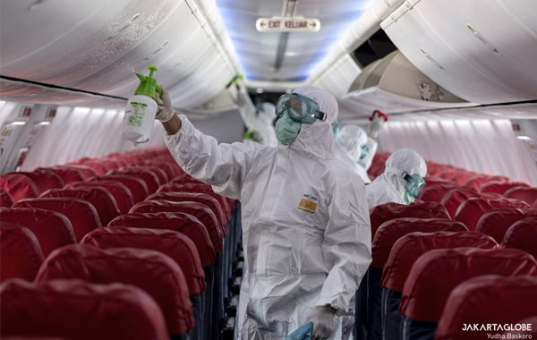 Airport Health Authorities officers disinfect a Lion Air Boeing 737-800 at Soekarno-Hatta International Airport. on March 17, 2020. (JG Photo/Yudha Baskoro)