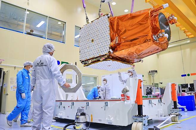 South Korean researchers test the country’s new mid-sized satellite that will be launched on March 20, from Kazakhstan. (Yonhap)