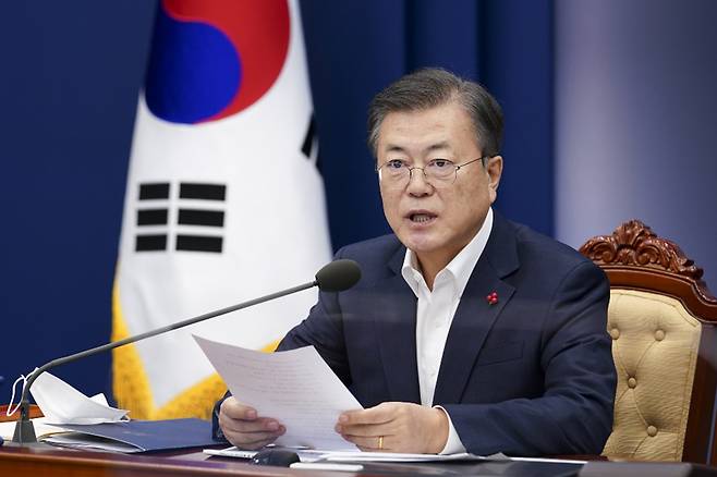 President Moon Jae-in speaks at a meeting tied to briefings from health authorities held at Cheong Wa Dae on Monday. (Yonhap)