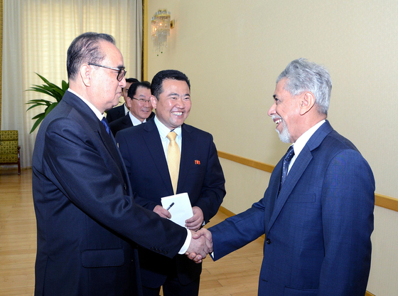 Ryu Hyun-woo, North Korea's former acting ambassador to Kuwait, is pictured at center in this state media photograph, accompanying North Korea's foreign minister at the time, Ri Su-yong, left, in a meeting with Omani envoys in Pyongyang in 2015. [YONHAP]