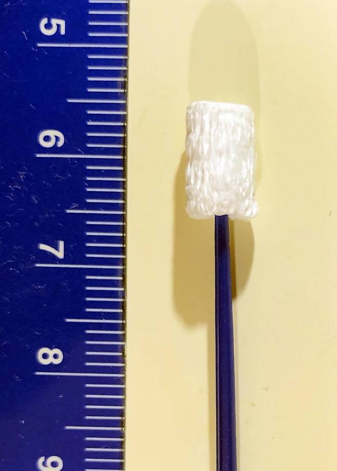 A nanofiber swab, developed to allow more accurate and sensitive COVID-19 testing (Adapted from Nano Letters 2021, DOI: 10.1021/acs.nanolett.0c04956)