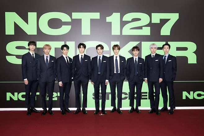 NCT 127 poses at the “Sticker” media showcase Friday. (S.M. Entertainment)