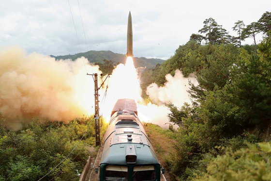 A ballistic missile is fired from a train-borne missile regiment in an undisclosed location in North Korea on Wednesday. [NEWS1]